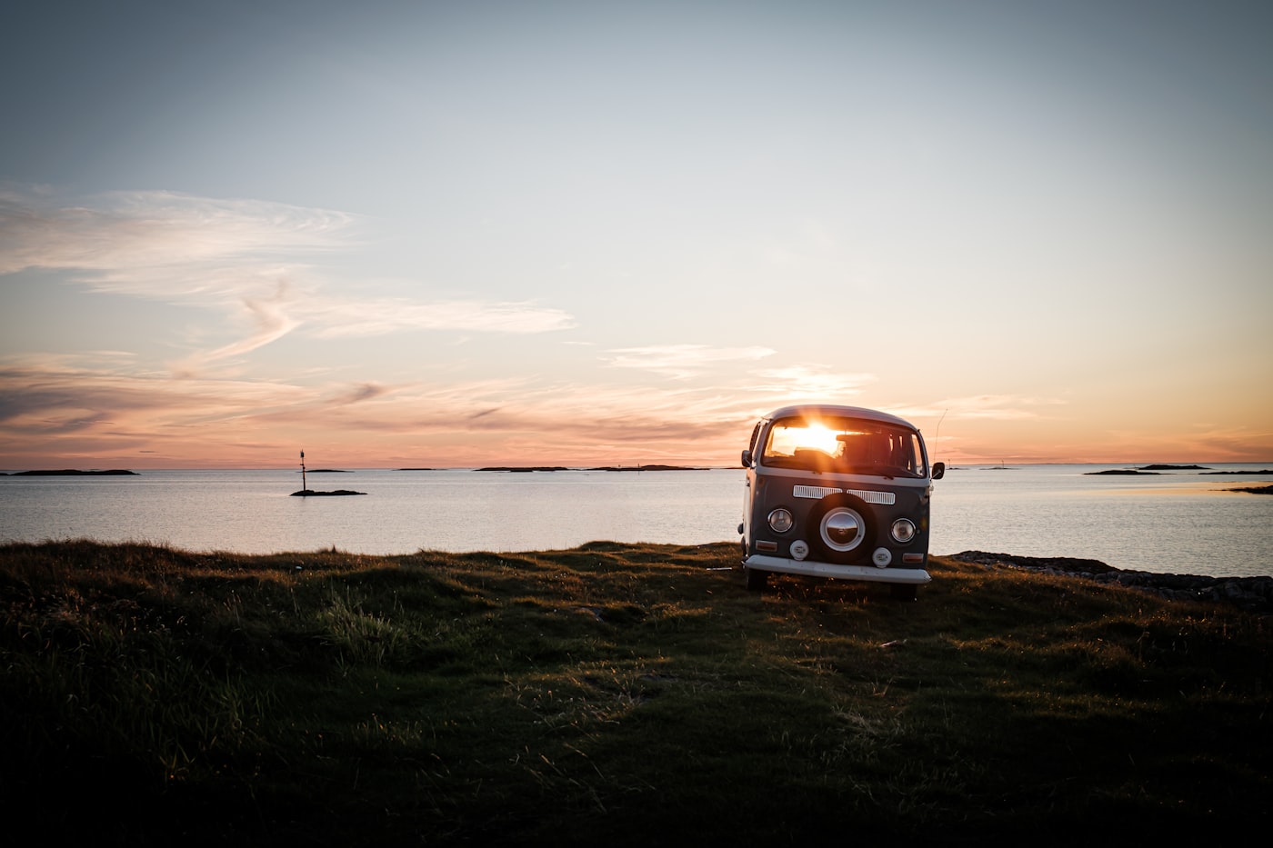 Camper van on a coastal road at sunset in Morocco
